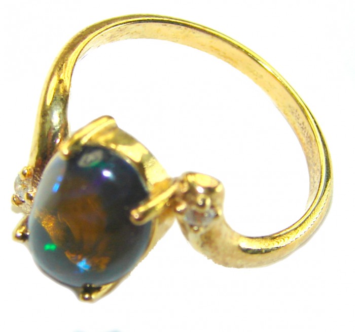 A Milky Way Genuine 4.8 carat Black Opal 18K Gold over .925 Sterling Silver handmade Ring size 7 1/2 - Gold ring with black opal, side view showing stone and setting detail.