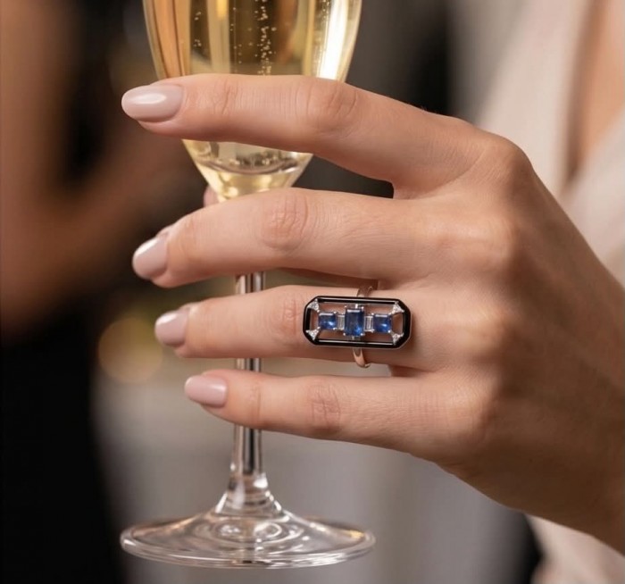 Art Deco 6.2 carat Sapphire black enamel .925 Sterling Silver handcrafted Ring size 6 - Sapphire and enamel ring worn on hand holding a champagne glass.