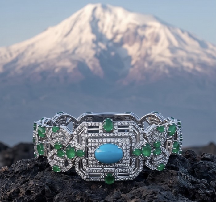 Art Deco - Pacifica - 98.4 carat Turquoise Emerald .925 Sterling Silver handmade Statement Bracelet - Close-up of Art Deco bracelet with turquoise and emeralds, mountain backdrop
