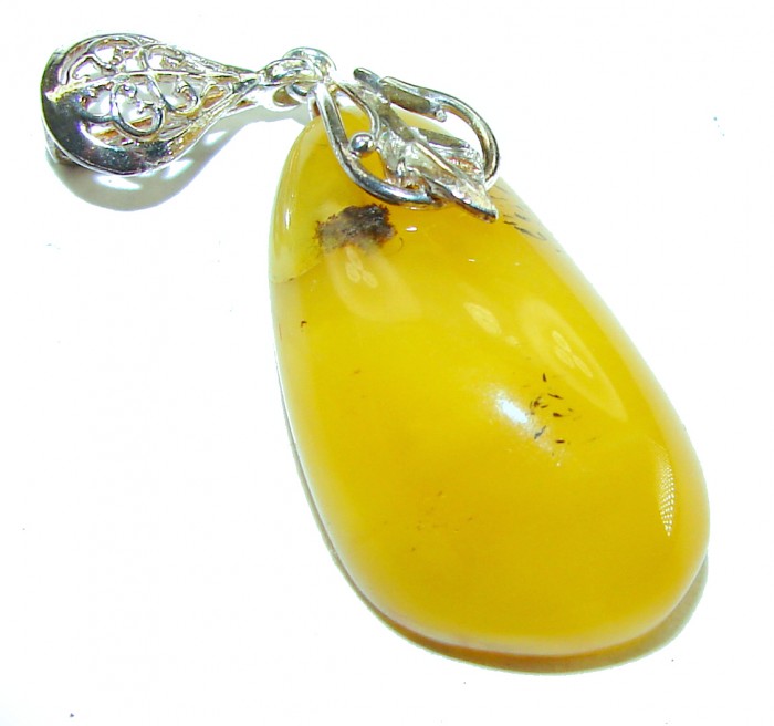 Prehistoric Authentic Baltic Amber .925 Sterling Silver beautifully handcrafted Pendant - Close-up of Baltic amber pendant with intricate silver detail.