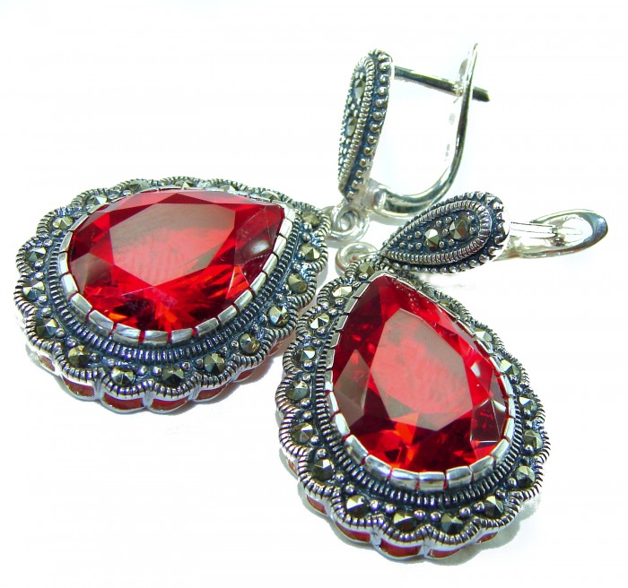 Crimson Fire Authentic 18.9 carat Garnet .925 Sterling Silver brilliantly handcrafted earrings - Close-up of Crimson Fire Garnet earrings, sterling silver setting.