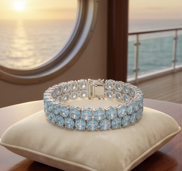Tiffany - Magnificent 112.5 carat Swiss Blue Topaz .925 Sterling Silver handcrafted Heavy Bracelet - Blue topaz bracelet on cushion with ship window background.