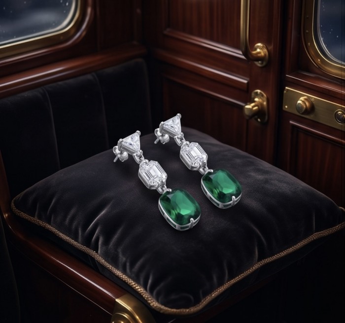 Giovanna- Authentic 8.5 CARAT natural Colombian Emerald .925 Sterling Silver handcrafted Statement earrings - Emerald earrings on velvet cushion, showcasing front detail.