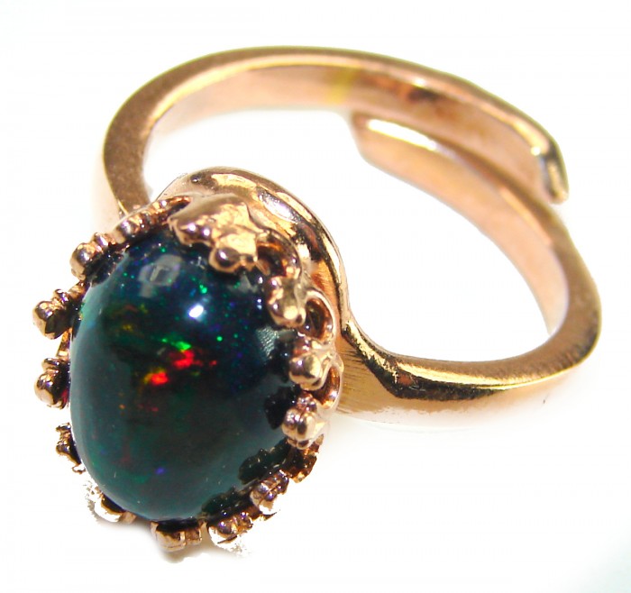 A COSMIC POWER Genuine 9.2 carat Black Opal 18K Gold over .925 Sterling Silver handmade Ring size 8 - Close-up of a black opal ring with gold setting.