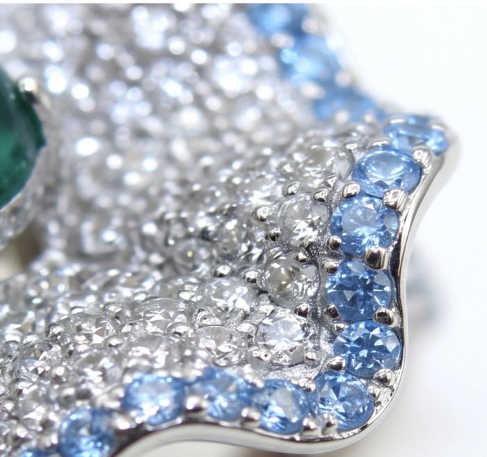 Exotica 5.2 carat natural Emerald rhodium over .925 Sterling Silver Perfectly handcrafted Ring s. 6 - Stone close-up of Exotica emerald with blue and white gemstones.
