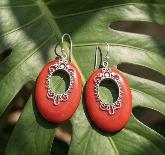 LARGE - Genuine Red Fossilized Coral .925 Sterling Silver handmade earrings - Red coral and silver earrings on a leaf, front view.