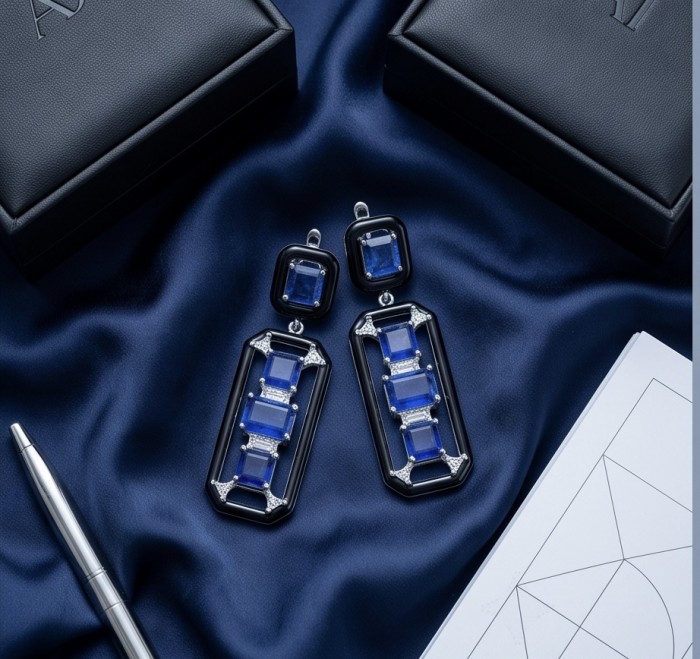 Art Deco 11.5 carat Sapphire black enamel .925 Sterling Silver handcrafted earrings - Top view of Art Deco sapphire earrings on blue silk background.