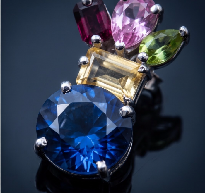 Blue Magic 15.5 carat London Blue Topaz .925 Sterling Silver handmade Statement earrings - Close-up of Blue Magic London Blue Topaz and multicolor gemstone setting.