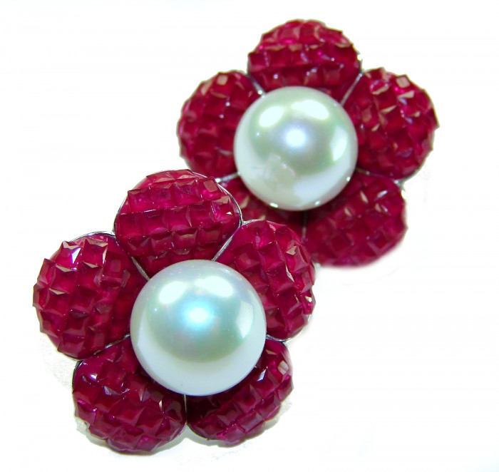 Born to Glam authentic 15.2 carat Ruby Pearl .925 Sterling Silver handcrafted earrings - Close-up of Born to Glam ruby and pearl flower-shaped earrings.