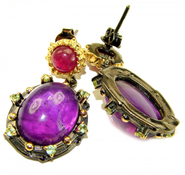 Natural 22.6 carat fancy Amethyst 18K black rhodium Gold over .925 Sterling Silver handmade earrings - Close-up of amethyst and ruby earrings with gold detailing.