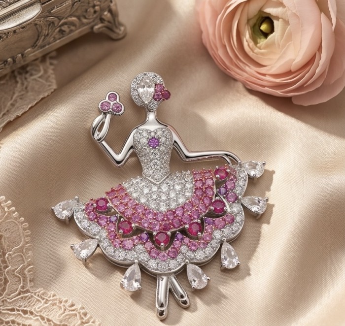 Ballerina - Precious 8.2 carat Colombian Ruby rhodium over .925 Sterling Silver handmade Pendant - Brooch - Ballerina brooch close-up with rubies and diamonds on satin fabric.
