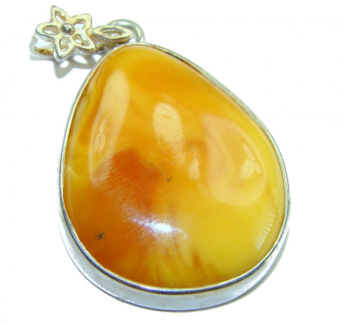Prehistoric Authentic Baltic Amber .925 Sterling Silver beautifully handcrafted Pendant - Close-up of Baltic amber pendant with sterling silver floral detail.