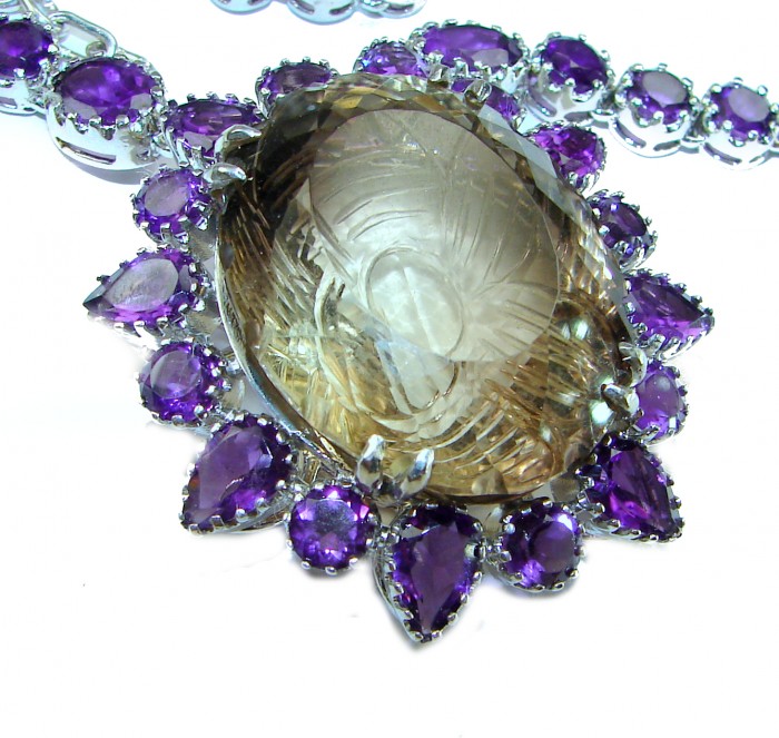Outstanding 155.4 carat Autehntic carved Smoky Topaz Amethyst .925 Sterling Silver handcrafted Statement necklace - Close-up of carved smoky topaz and amethyst necklace centerpiece.