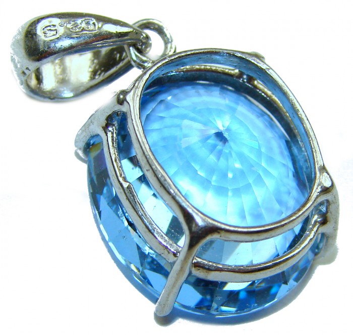 Pacifica fancy oval cut 16.5 carat London Blue Topaz .925 Sterling Silver handmade Pendant - Blue topaz pendant close-up with silver setting details.