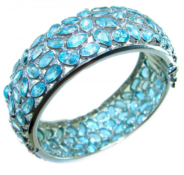 Blue Odyssey- One of the kind - 165.2 carat Swiss Blue Topaz .925 Sterling Silver handmade bangle Bracelet - Side view of Blue Odyssey bracelet with Swiss Blue Topaz stones.