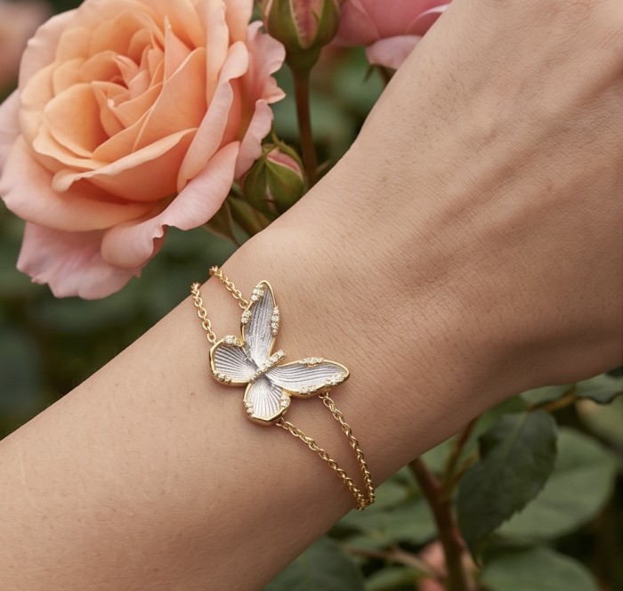 Golden Butterfly White Topaz highly polished 18K Gold over .925 Sterling Silver Italy made bracelet - Butterfly bracelet in 18K gold worn on wrist near pink rose.