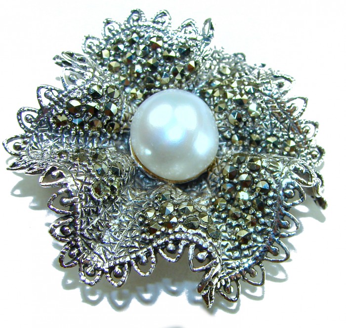 Genuine white Pearl Marcasite .925 Sterling Silver handcrafted Brooch - Close-up of silver brooch with genuine white pearl and marcasite detail.