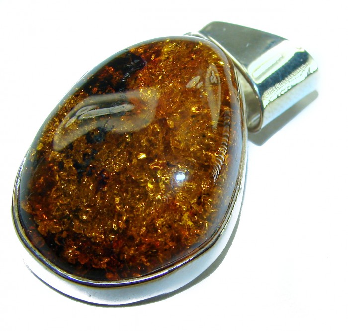 Golden natural Baltic Amber .925 Sterling Silver handmade Pendant - Close-up of golden Baltic amber pendant in sterling silver setting.