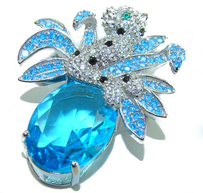 Blue Cheetah authentic 12.5 carat Swiss Blue Topaz .925 Sterling Silver Handcrafted pendant brooch - Blue Cheetah pendant with Swiss Blue Topaz, top view close-up.