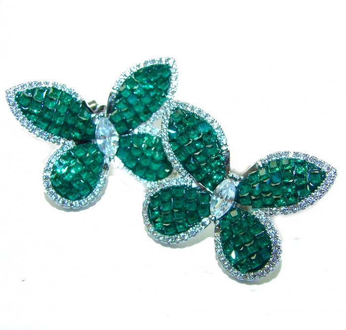 Incredible Butterflies genuine 15.2 carat Emerald .925 Sterling Silver handcrafted Earrings - Butterfly-shaped emerald earrings, top view, on white background.