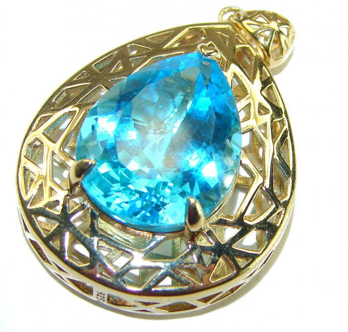 Oceania Pear cut 22.8 carat Swiss Blue Topaz 18K Gold over .925 Sterling Silver Handcrafted Pendant - Close-up of pear-cut Swiss Blue Topaz pendant in gold setting