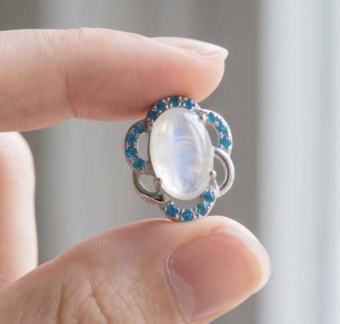Genuine 7.2 carat Fire Moonstone .925 Sterling Silver handcrafted pendant - Close-up of a 7.2 carat Fire Moonstone in sterling silver setting.