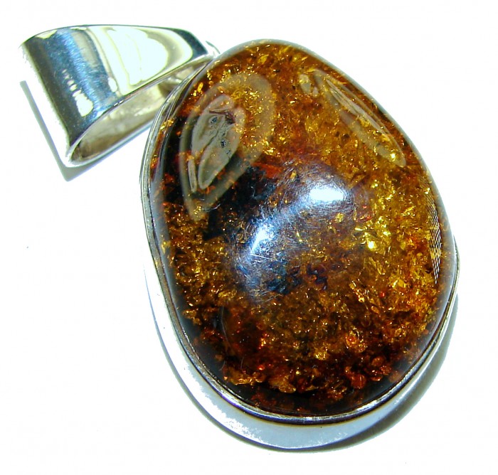 Golden natural Baltic Amber .925 Sterling Silver handmade Pendant - Close-up of Baltic amber and sterling silver pendant.