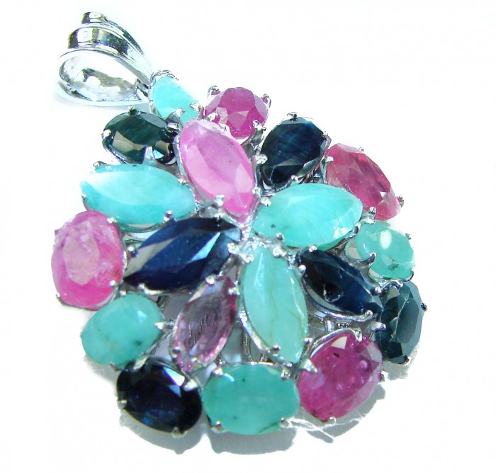 Precious Genuine 21.5 carat Emerald Ruby Sapphire .925 Sterling Silver handmade Pendant - Close-up of a colorful gemstone pendant with emerald, ruby, and sapphire.