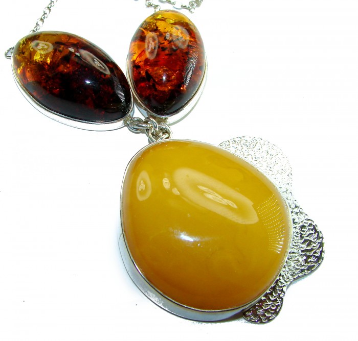 Rare Creation - natural Baltic Amber .925 Sterling Silver handcrafted necklace - Close-up of natural Baltic amber pendant with sterling silver setting.