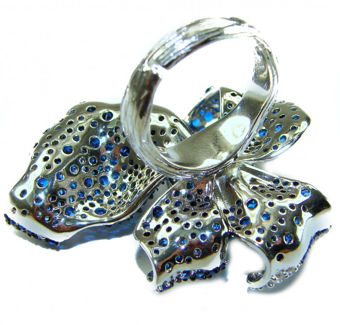 Wild Flower 55.2 carat authentic Colombian Emerald Sapphire.925 Sterling Silver handcrafted Statement Ring size 6 1/4 - Top view of metallic flower ring with blue sapphires.