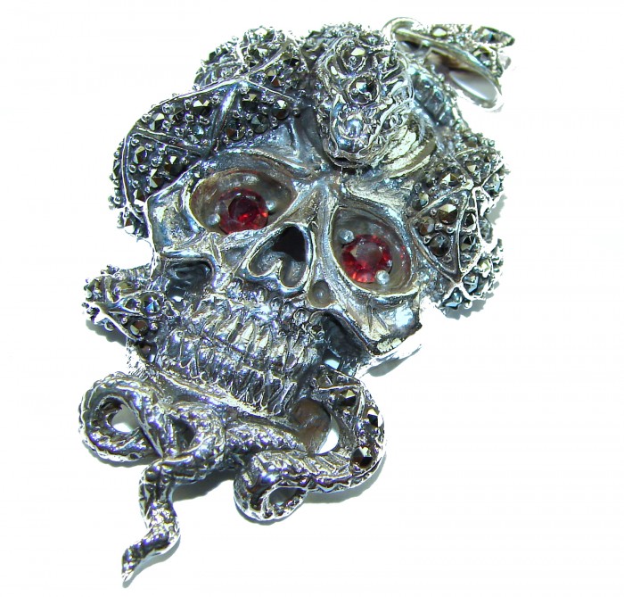 the cycle of renewal 2.1 carat Ruby Authentic Ruby Marcasite .925 Sterling Silver handcrafted Pendant - Silver skull pendant with red eyes, snake detail, top view.