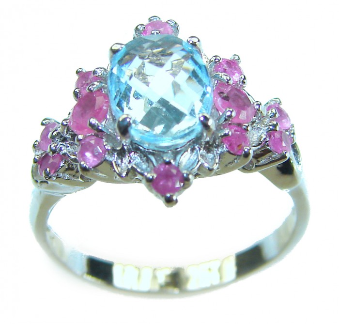 5.8 carat Swiss Blue Topaz Ruby .925 Sterling Silver handcrafted ring size 7 - Ring with Swiss Blue Topaz and rubies, front angle, sterling silver band.