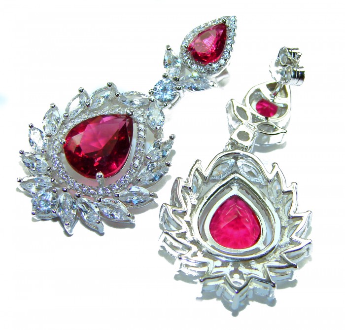 Tiffany - authentic 7.5 carat Ruby .925 Sterling Silver dipped in rhodium handcrafted Statement Earrings - Close-up of Tiffany ruby earrings in sterling silver with decorative stones.