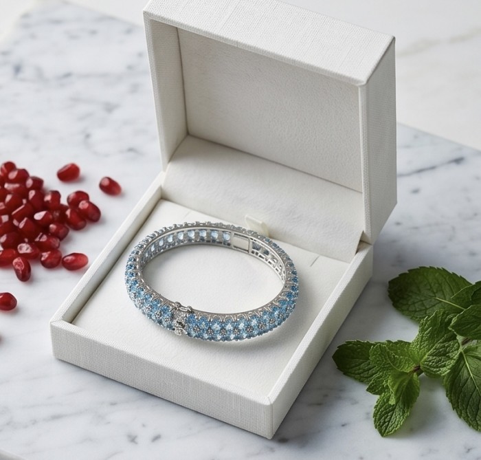 Serenity - Spectacular authentic 152.7 carat Swiss Blue Topaz .925 Sterling Silver handmade bangle Bracelet - Blue topaz bracelet in box with mint leaves and pomegranate seeds nearby