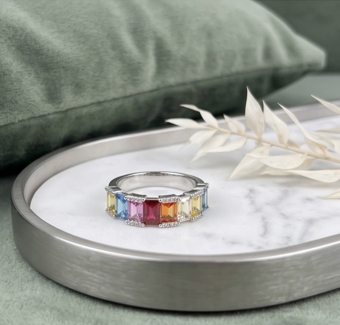 My own Rainbow - authentic 8.7 carat Topaz .925 Sterling Silver Ring size 7 1/4 - Topaz rainbow ring on marble tray, angled view, with decorative leaf.