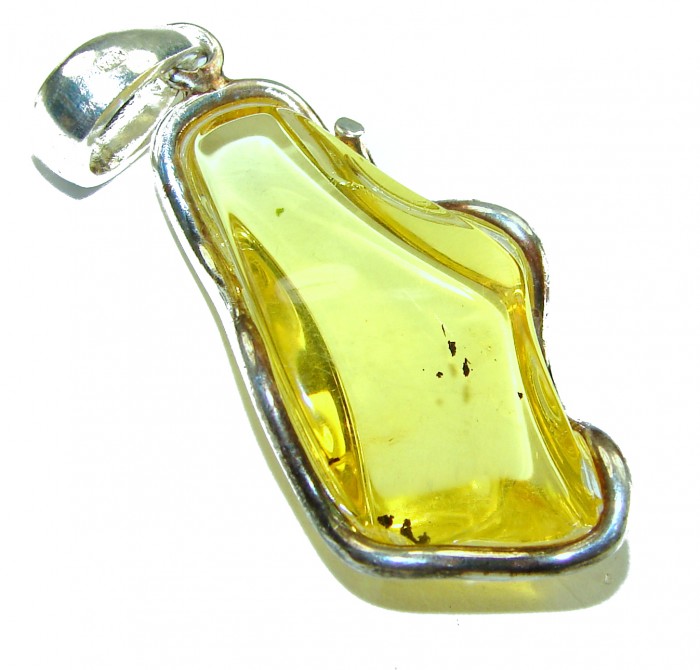 Prehistoric Authentic Baltic Amber .925 Sterling Silver beautifully handcrafted Large Pendant - Side view of Baltic amber pendant with .925 sterling silver setting.