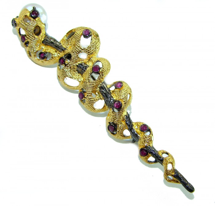 Golden Boa Snake 12.5 carat Ruby 14K Gold over .925 Sterling Silver handcrafted Pendant Brooch - Side view of snake-shaped gold and ruby bracelet on sterling silver.