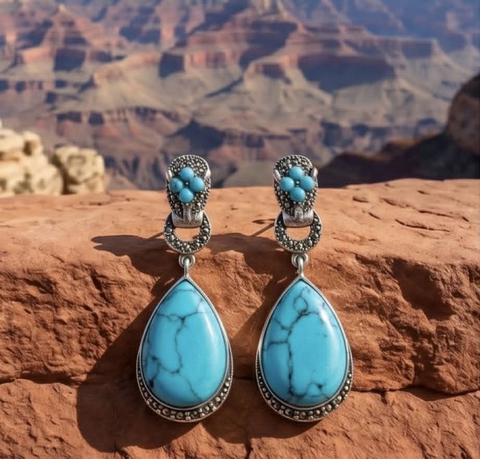 Gephard - Spectacular inkay Turquoise Marcasite .925 Sterling Silver handcrafted Earrings - Turquoise earrings on rock with canyon background, front view.