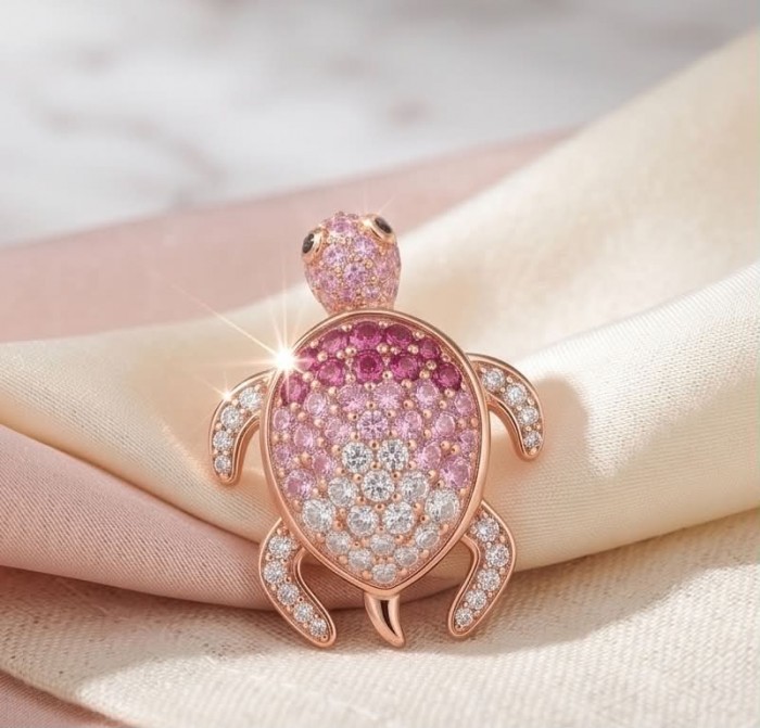 Pink Turtles - authentic 10.8 carat Pink Sapphire 18K Rose Gold over .925 Sterling Silver handcrafted Earrings - Turtle-shaped brooch with pink sapphires and diamonds on fabric background.