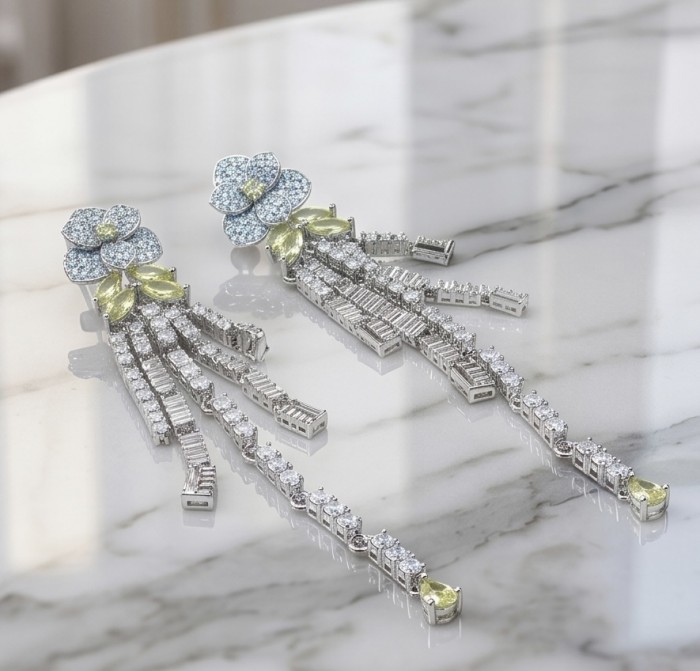 Luxurious Golden - 8.2 carat yellow Montana Sapphire .925 Sterling Silver handcrafted Statement earrings - Elegant dangling earrings on marble surface, showcasing sapphires.