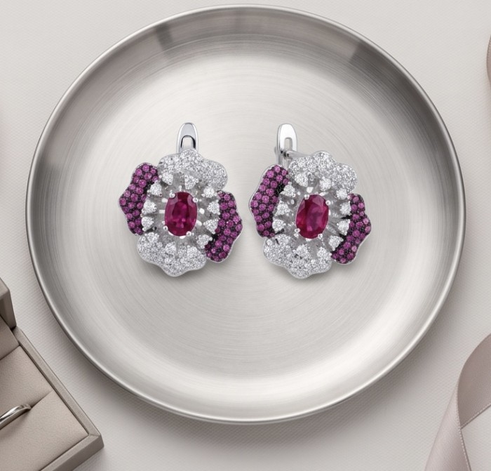 Natural 4.2 carat Mozambique Ruby .925 Sterling Silver dipped in 22K Gold Handcrafted Earrings - Top view of 4.2 carat Mozambique ruby earrings on a silver plate.