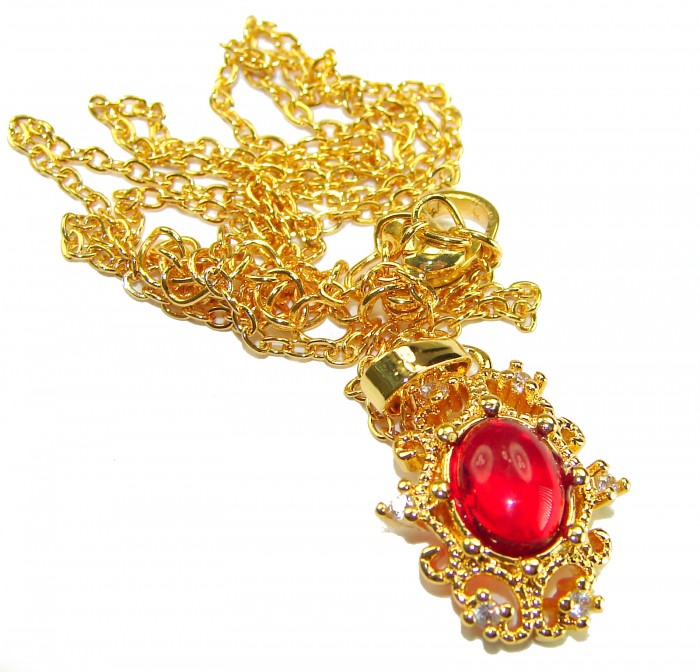 ESTANCIA Sublime natural Red topaz 10K Gold over Sterling Silver handmade Necklace - Gold chain with red topaz pendant, intricate detailing, close-up view.