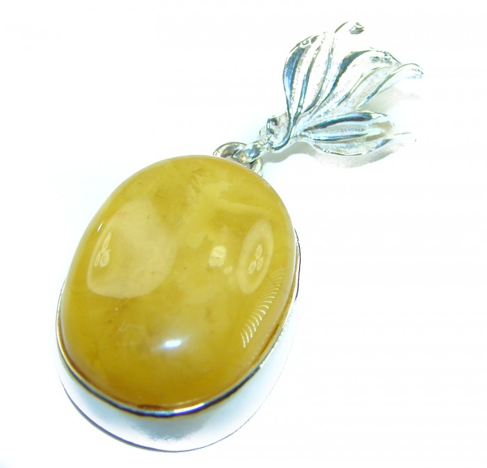 Prehistoric Authentic Buttescotch Baltic Amber 14K Gold over .925 Sterling Silver beautifully handcrafted Pendant - Close-up of Prehistoric Butterscotch Baltic Amber pendant with silver bail.