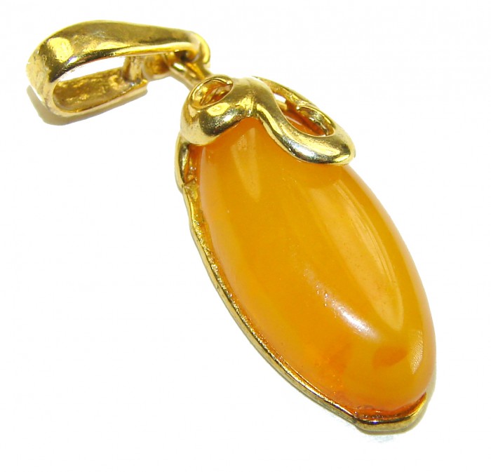 Prehistoric Authentic Baltic Amber .925 Sterling Silver beautifully dipped in 18K GOLD handcrafted Pendant - Close-up of Baltic Amber pendant with gold-toned setting.