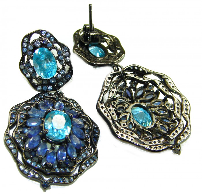 Atlantica 4.7 carat Swiss Blue Topaz .925 Sterling Silver dipped in black rhodium Handcrafted Statement earrings - Intricate Swiss Blue Topaz sterling silver earrings, angled display.
