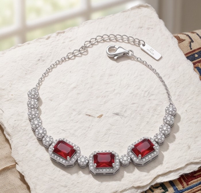 Serafina - Magnificent Jewel 9.8 carat Ruby .925 Sterling Silver handcrafted incredible Statement Bracelet - Bracelet on textured surface, showcasing ruby stones and clasp detail.
