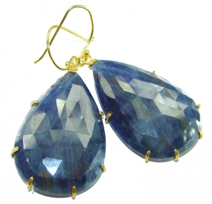 Giovanna - Authentic oval cut 27.9 carat faceted SAPPHIRE .925 Sterling Silver handcrafted earrings - Close-up of faceted sapphire earrings with gold prongs.