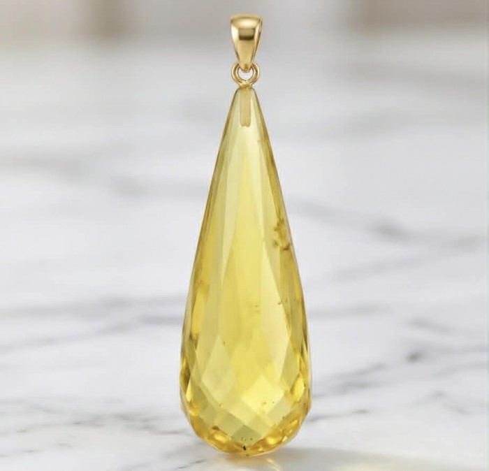Prehistoric Authentic faceted Golden Baltic Amber REAL 14k Gold beautifully handcrafted Pendant - Close-up of faceted golden Baltic amber pendant with gold bail.