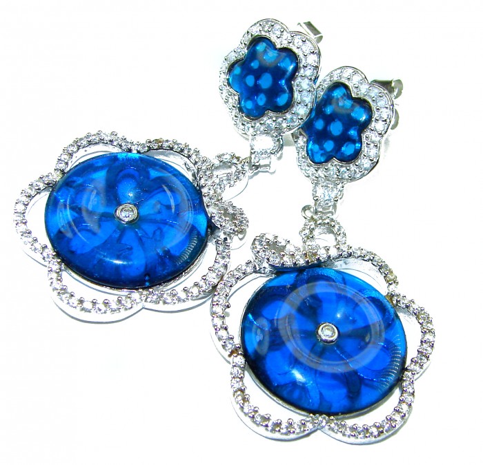 Giovanna - Authentic 21.9 carat Topaz .925 Sterling Silver handcrafted earrings - Close-up of blue topaz and sterling silver earrings with diamond accents.