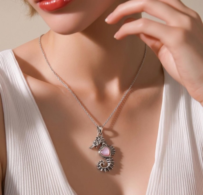 Seahorse Excellent quality 0.9 carat Pink Opal .925 Sterling Silver handcrafted Pendant - Seahorse necklace with pink opal worn on neck, close-up view.